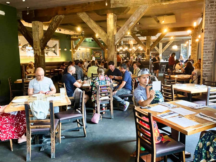 View of the completely filled Peche Restaurant