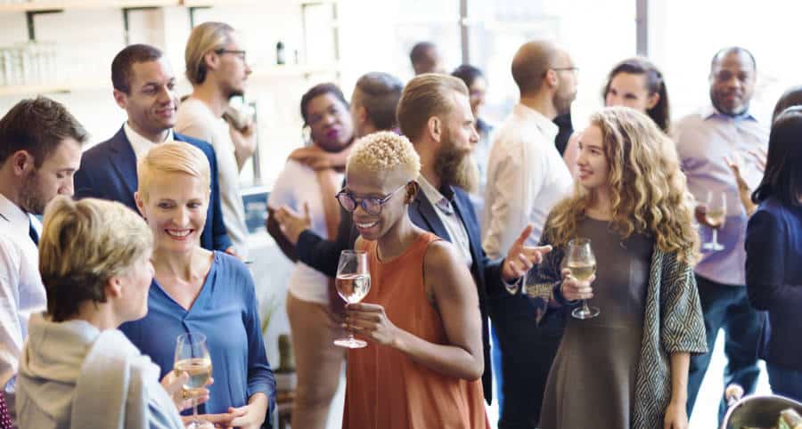 People drinking wine and champagne while socializing