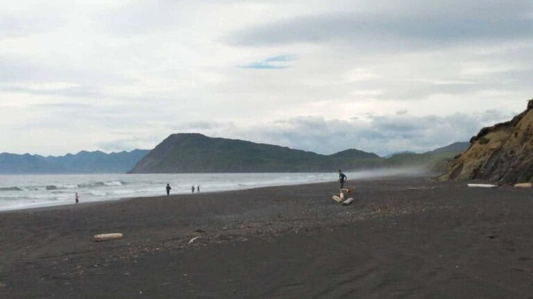 People enjoying their day in Kodiak beach on a a gloomy day