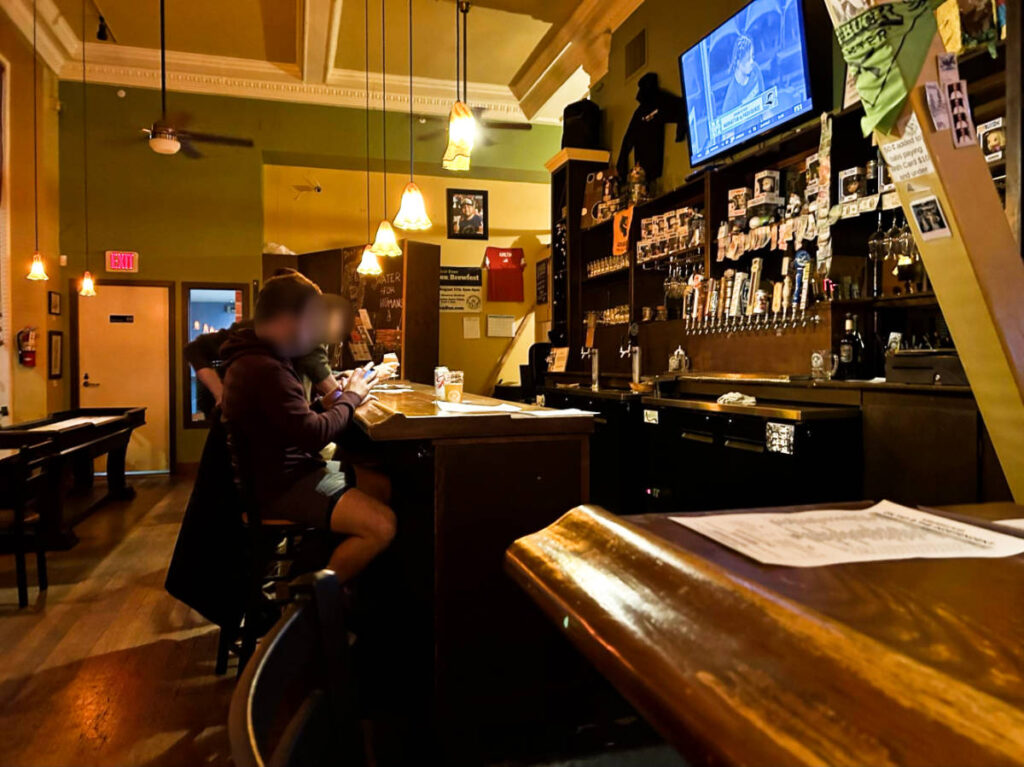 View of the men drinking at the bar counter of Independent Beer Bar