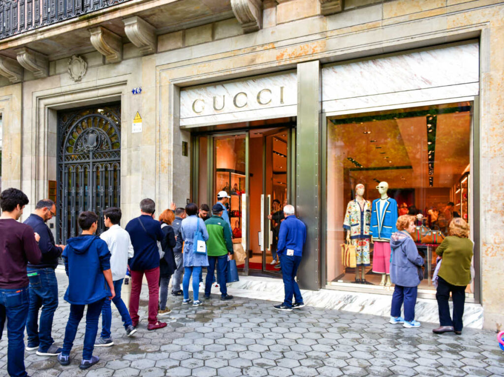 View of the people lining up outside the store of Gucci