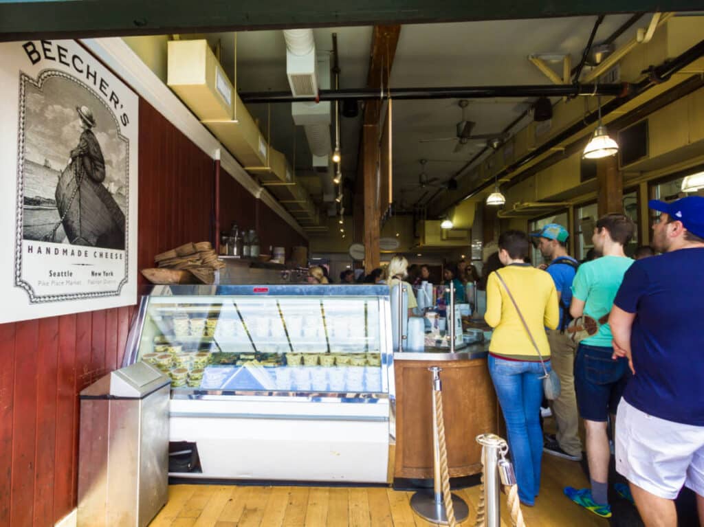 View of the people lining up at the counter near the entrance of Beecher’s Handmade Cheese