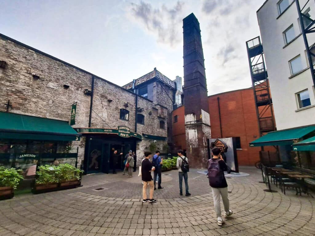 View of the people at the courtyard in front of The Jameson Distillery