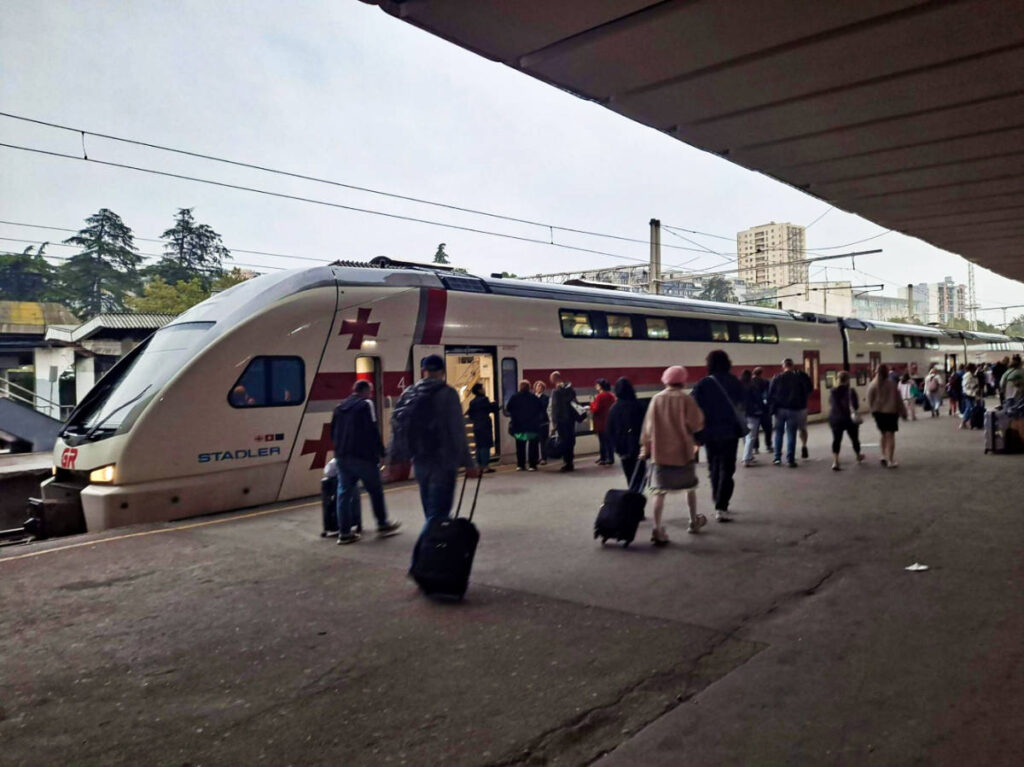 People walking outside the train