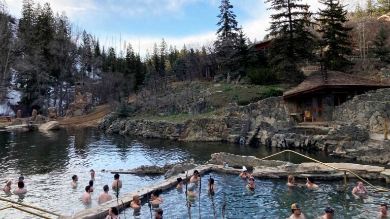 People soaking on a hot spring in Steamboat Springs, one of the best places when choosing where to stay in Steamboat Springs Colorado