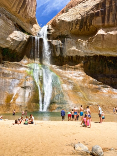 View of the people swimming and enjoying the scenic Lower Calf Creek Falls