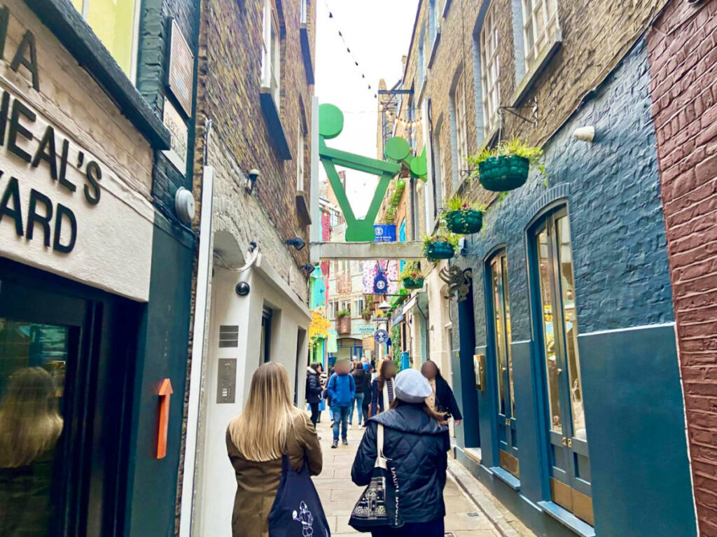 View of the people walking along the alley near the Neal’s Yard