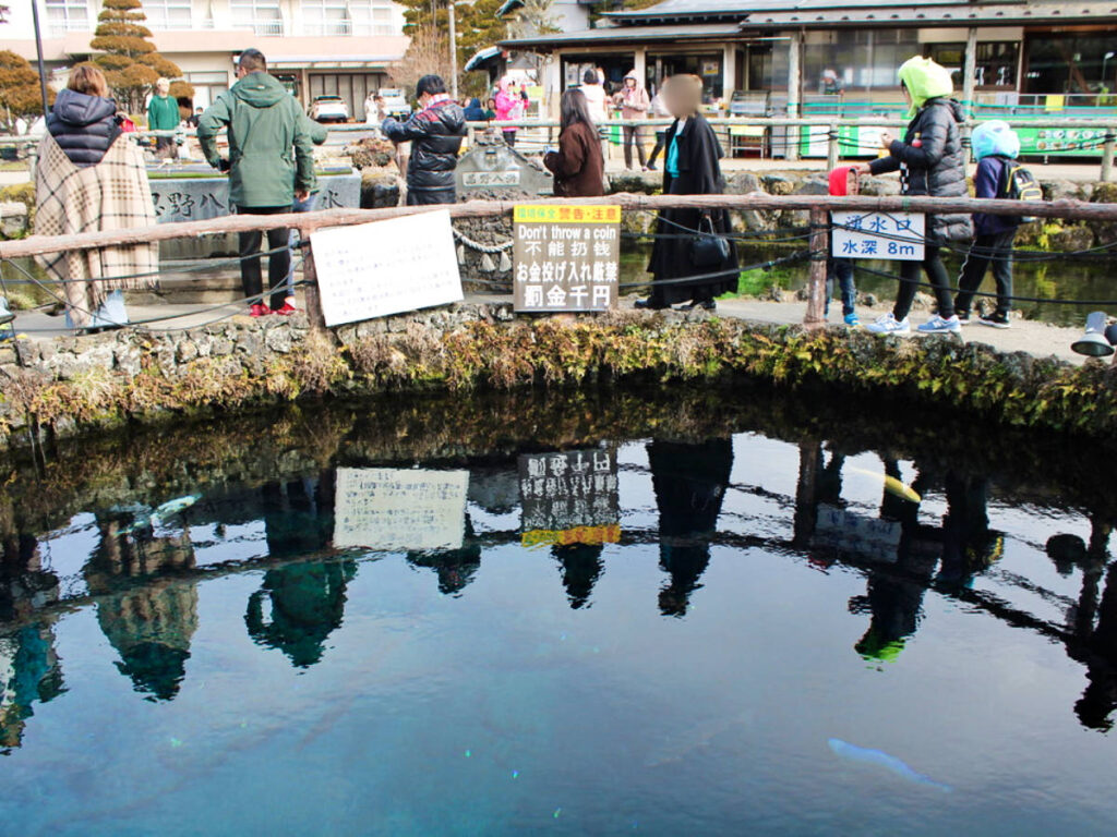 People wearing layered clothing in Oshino Hakkai