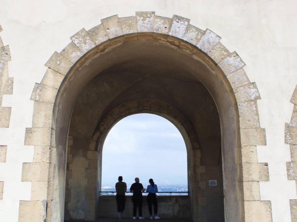 View of the people enjoying the overlooking view from the arches at Castel Sant'Elmo
