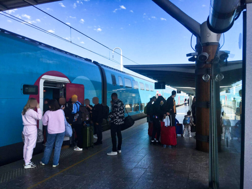 The people standing outside the French train