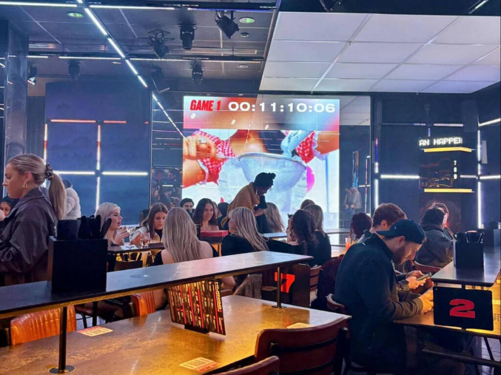 People playing and drinking at Hijingo Bingo