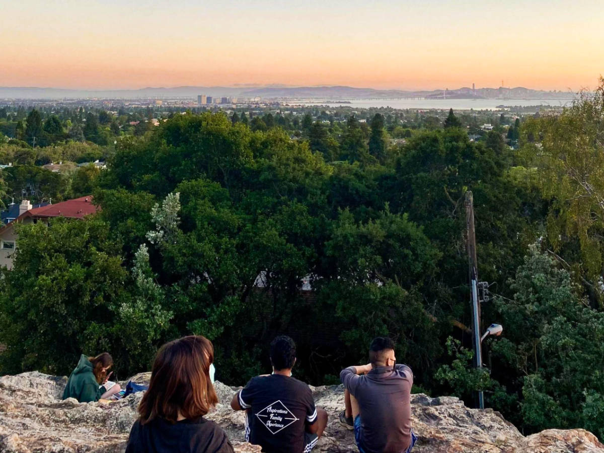 View of the people enjoying the overlooking view from the Indian Rock Park