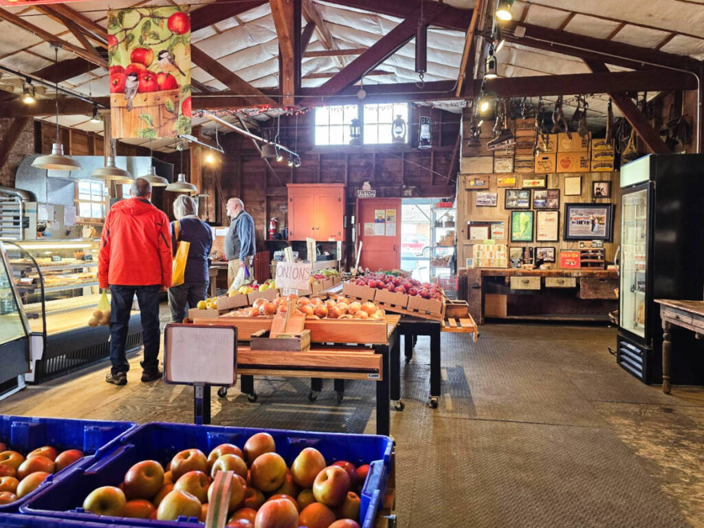 People buying fresh produce at the Johnson Orchards