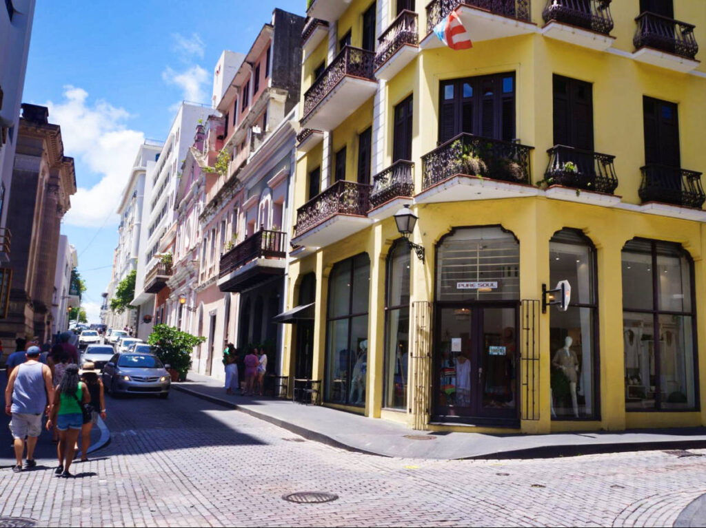 View of the cars and people walking along the street of Old San Juan
