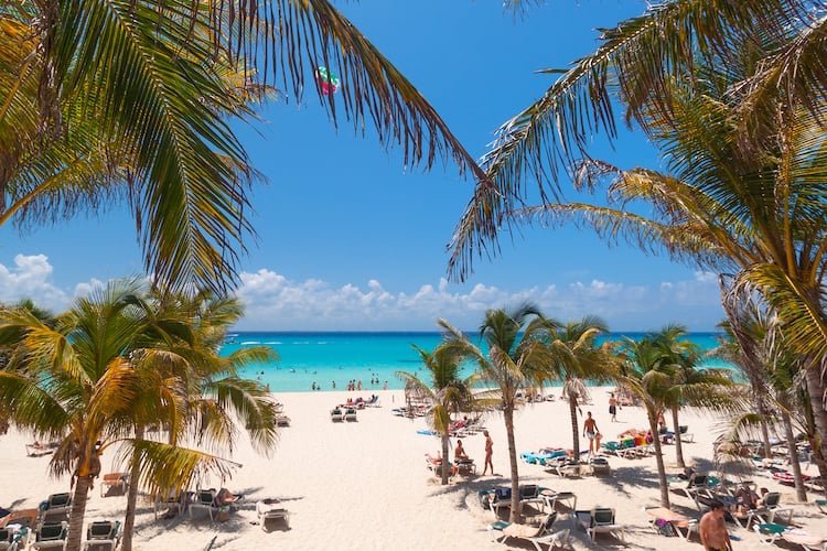 View of people enjoying the beach in Playa del Carmen