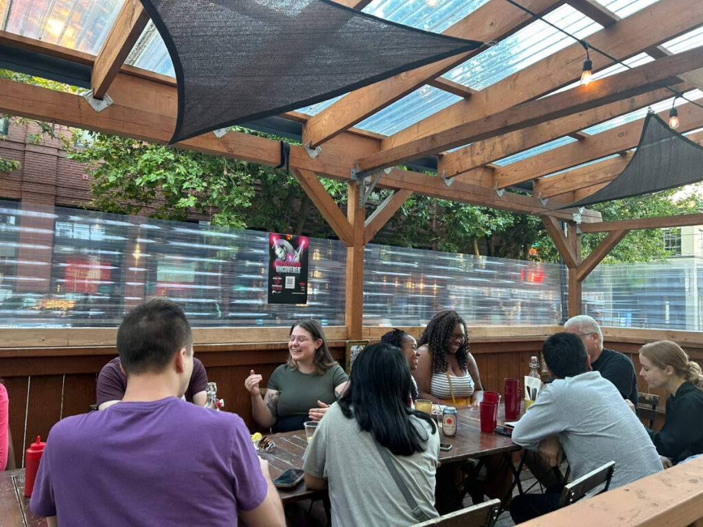 People sharing their travel stories at the Recent Seattle Travel Community Meetup