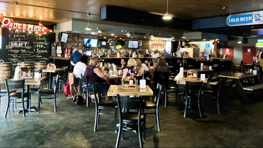 People dining inside Ugly Dog Saloon and BBQ