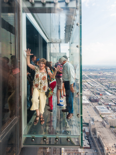 People enjoying their view in Willis Tower Skydeck