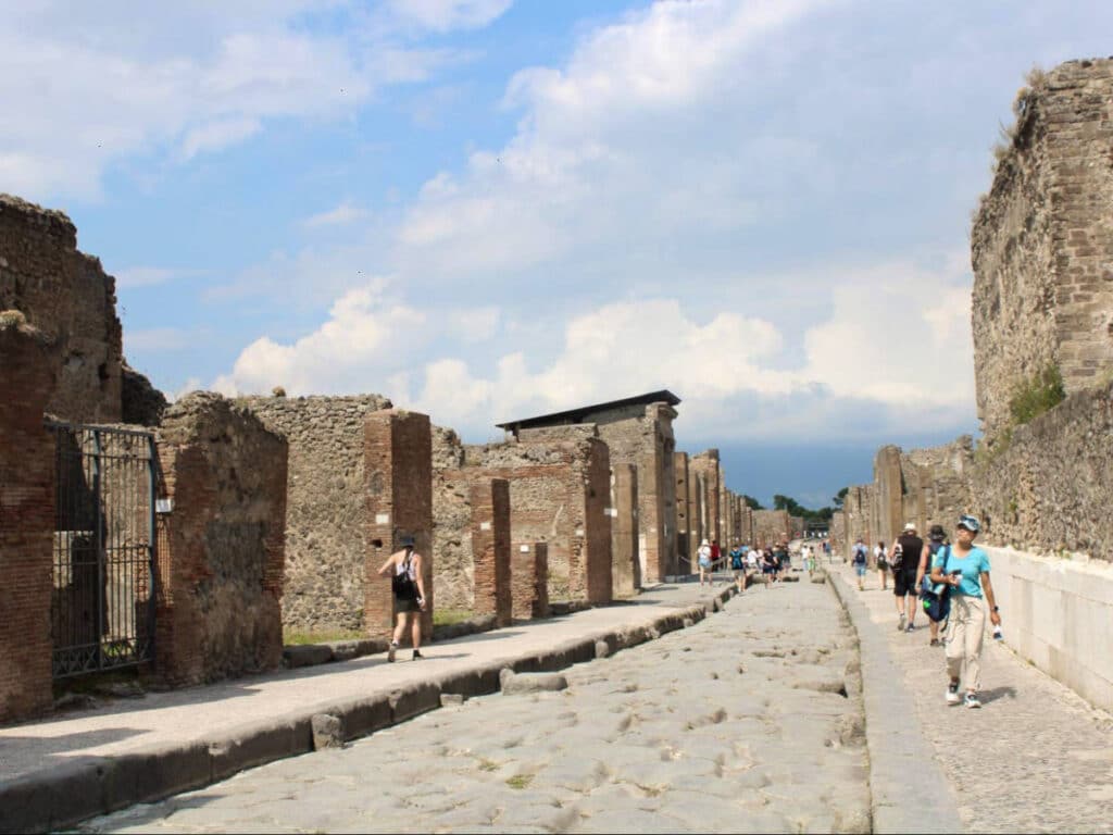 View of the people walking around the ancient city of Pompeii