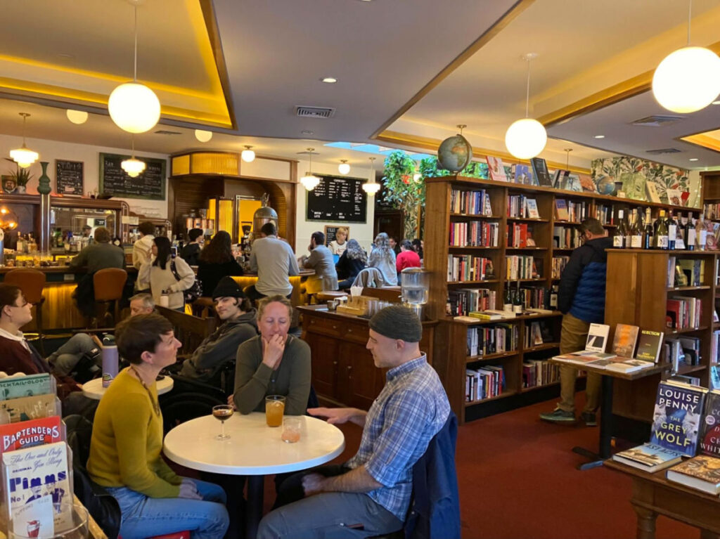 View of People dining and looking at books at Leopold's