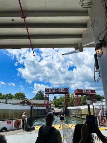 People riding the ferry on a sunny day
