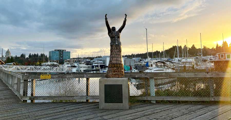One of the statues displayed in Percival Landing during sunset
