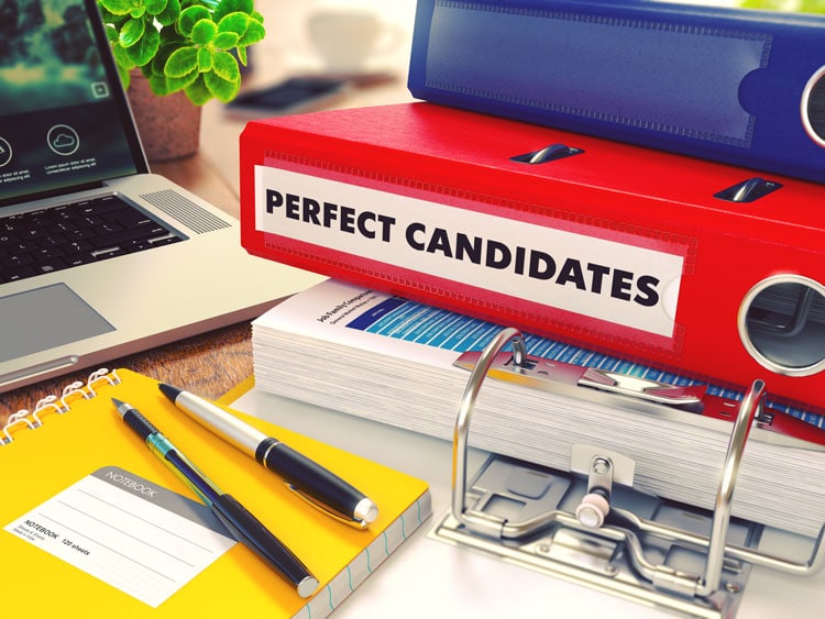 Yellow notebook and pens with folders of remote job seeker