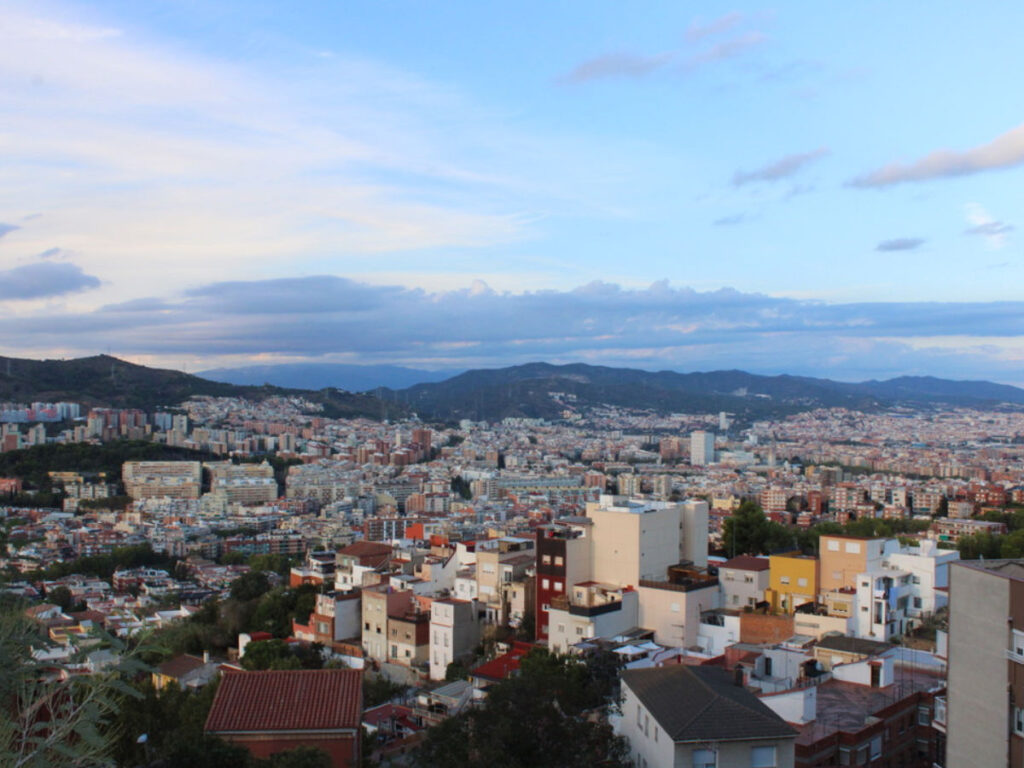 Blue sky over Gràcia, showcasing its distance from other areas of the city center