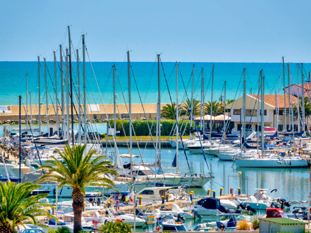 A marina in Pescara, filled with numerous boats docked in the harbor