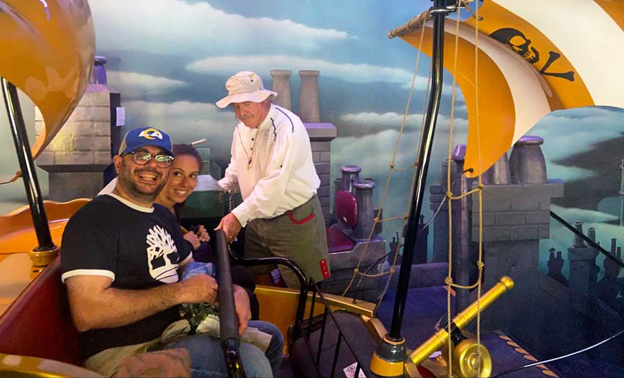 The author's family members smiling for a photo while on board Peter Pan’s Flight