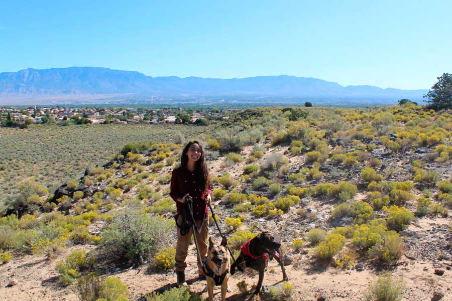 Abigail with her dogs at the Petroglyph National Monument