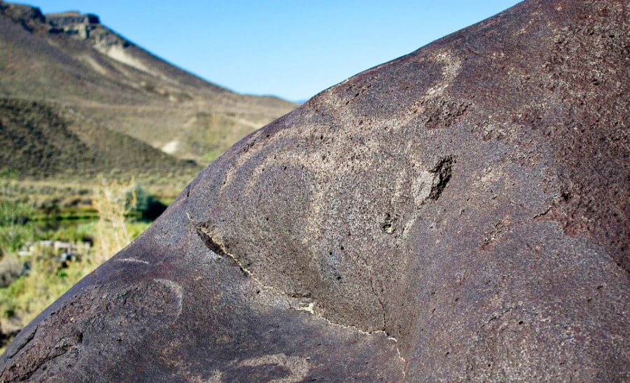 Dark brown petroglyph rock at Celebration Park