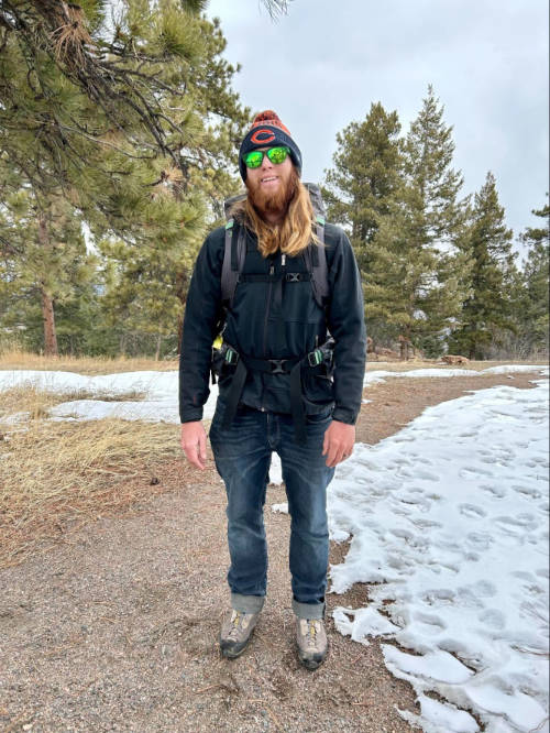 The author's husband carrying his Mountainsmith Apex 60 backpack