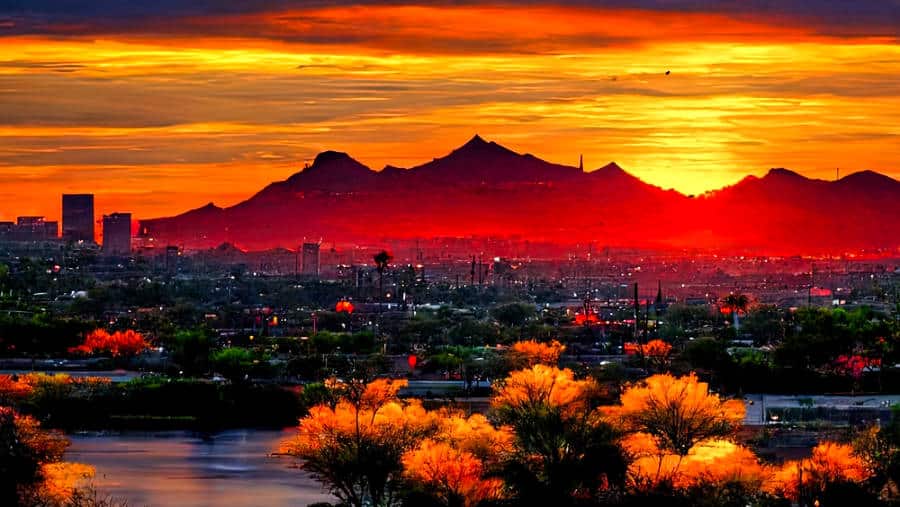 A breathtaking deep orange sunset view of the beautiful city of Phoenix.