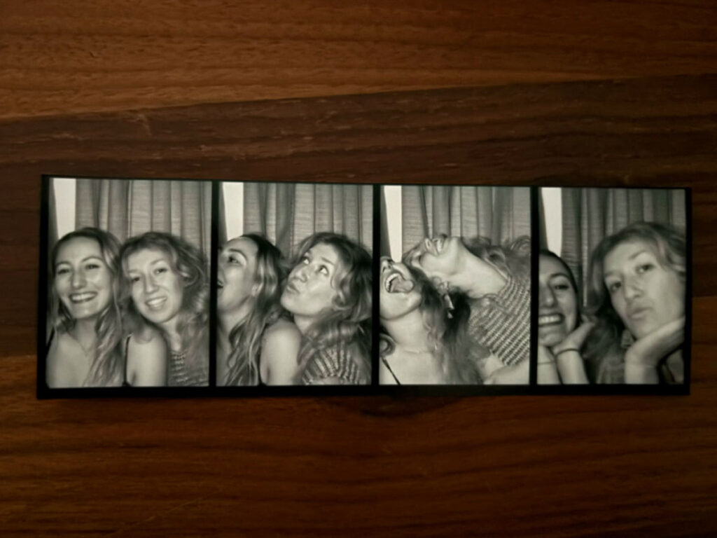 A photo strip of Travel Lemming Author Sky Ariella and her friend taken from North Star bar