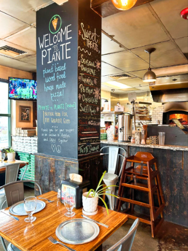 The menu on the huge column inside the Piante Pizzeria