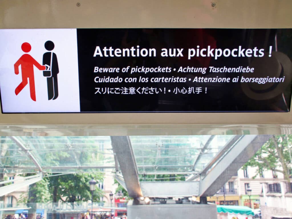 A warning about pickpockets on a signage in Montmartre Funicular