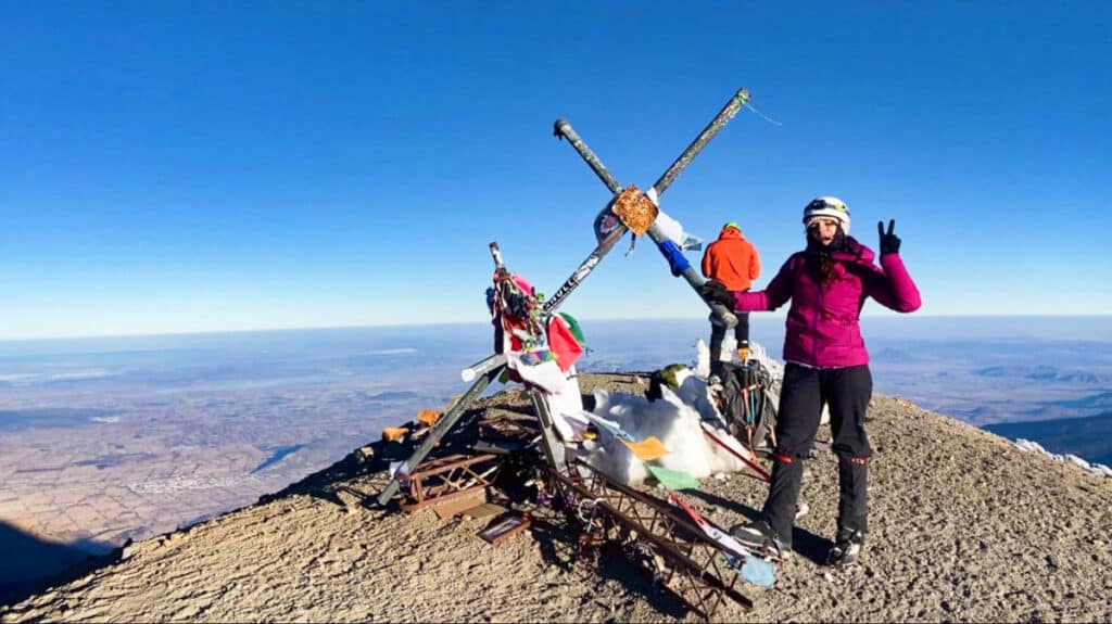 The author McKenna Mobley posing at the summit of Pico de Orizaba