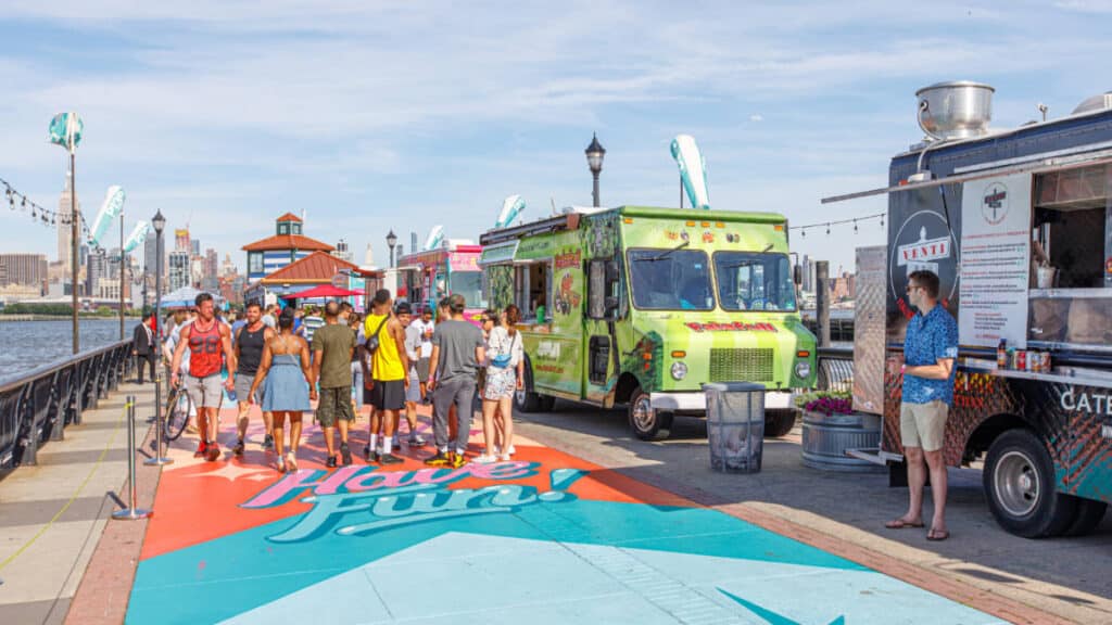 People and food trucks at the Pier 13 Hoboken