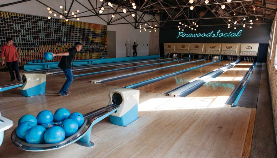 People playing bowling in Pinewood Social in Nashville