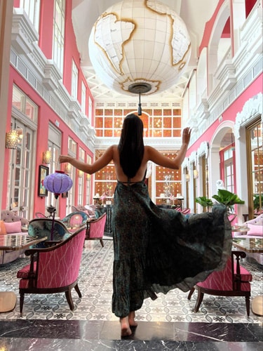 Clara posing for a photo inside the Pink Pearl