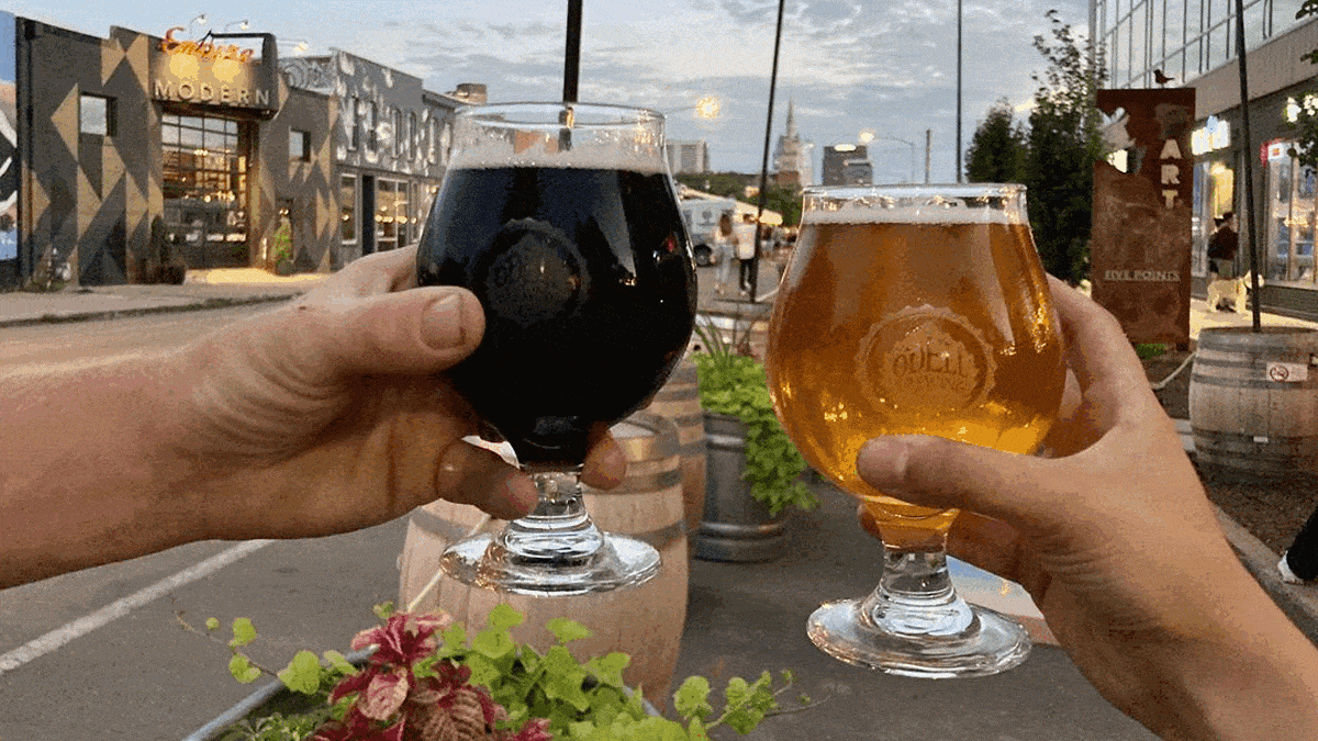 View of clinking glasses of Pints at Odell Brewing in the RiNo Arts District