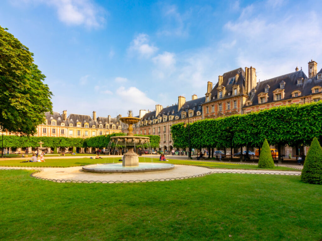 Green lawn at Place des Vosges in Le Marais neighborhood