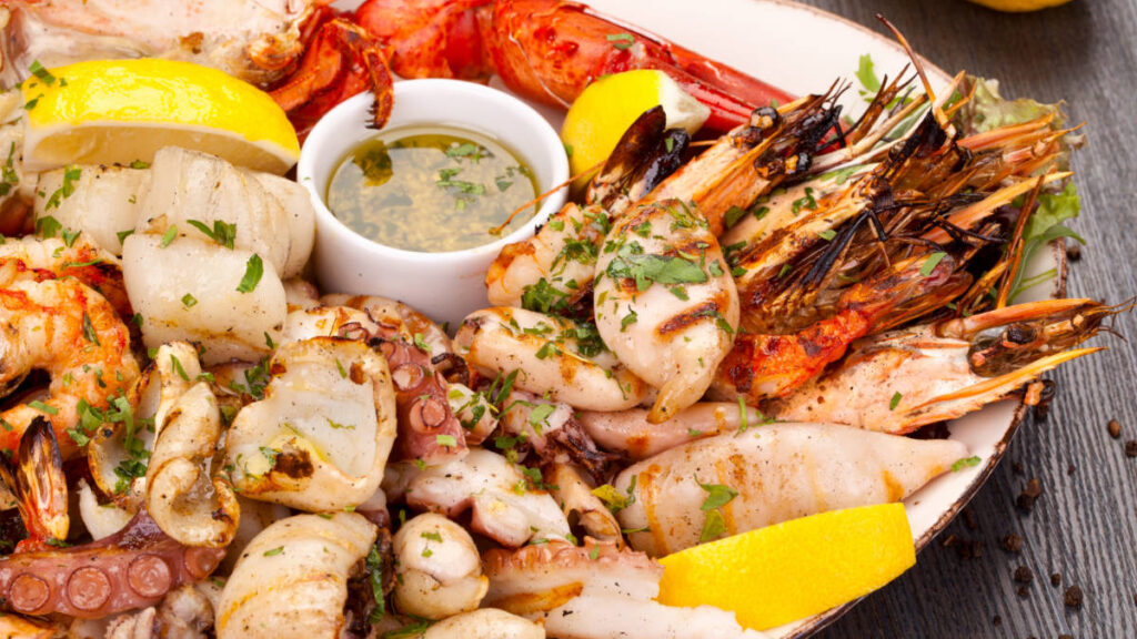 A plate of seafoods served on a restaurant