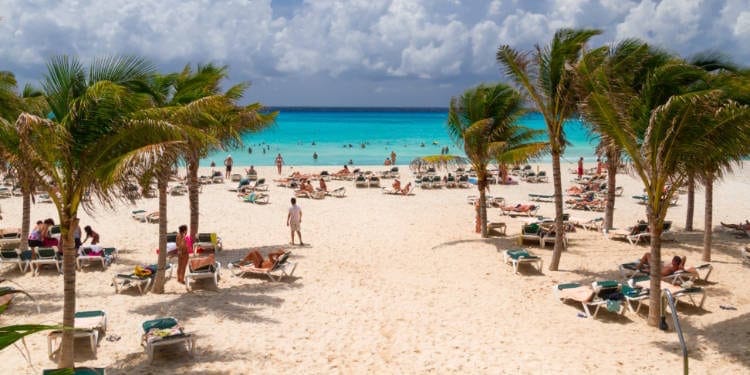 Beachgoers relax on Playacar Beach in Playa del Carmen