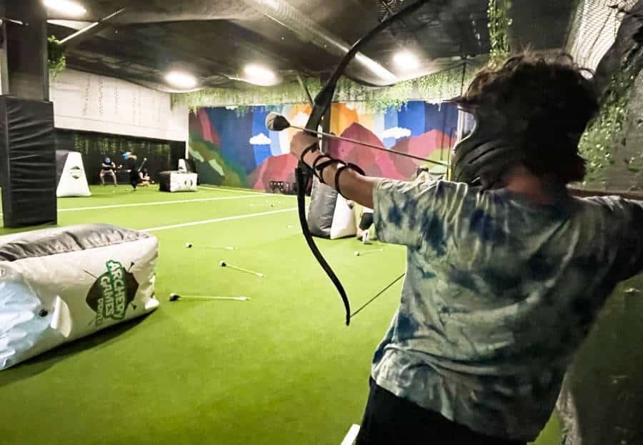 A man playing at the Archery Games Denver
