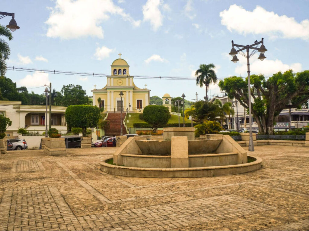 View of the cathedral behind the plaza in Moca