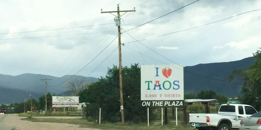 Signage of 'I love Taos' along the highway near the plaza