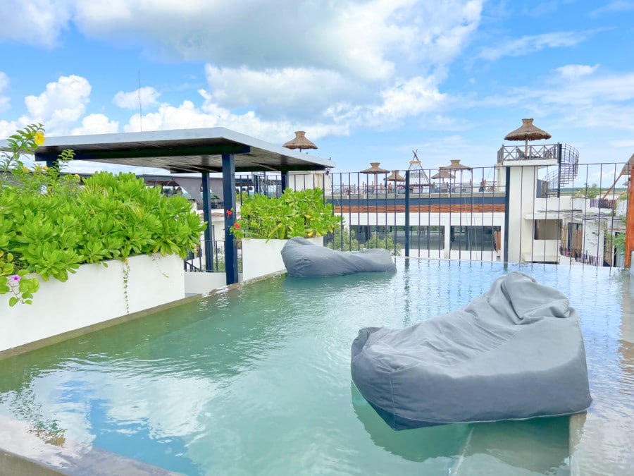 View of bean bag in pool at Naala hotel in Tulum