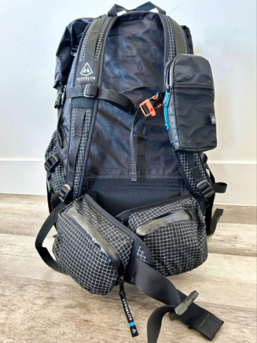 View of the shoulder pocket attached to the strap of the backpack